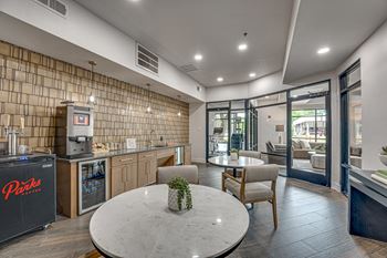 Coffee bar and lounge with seating and patio access
